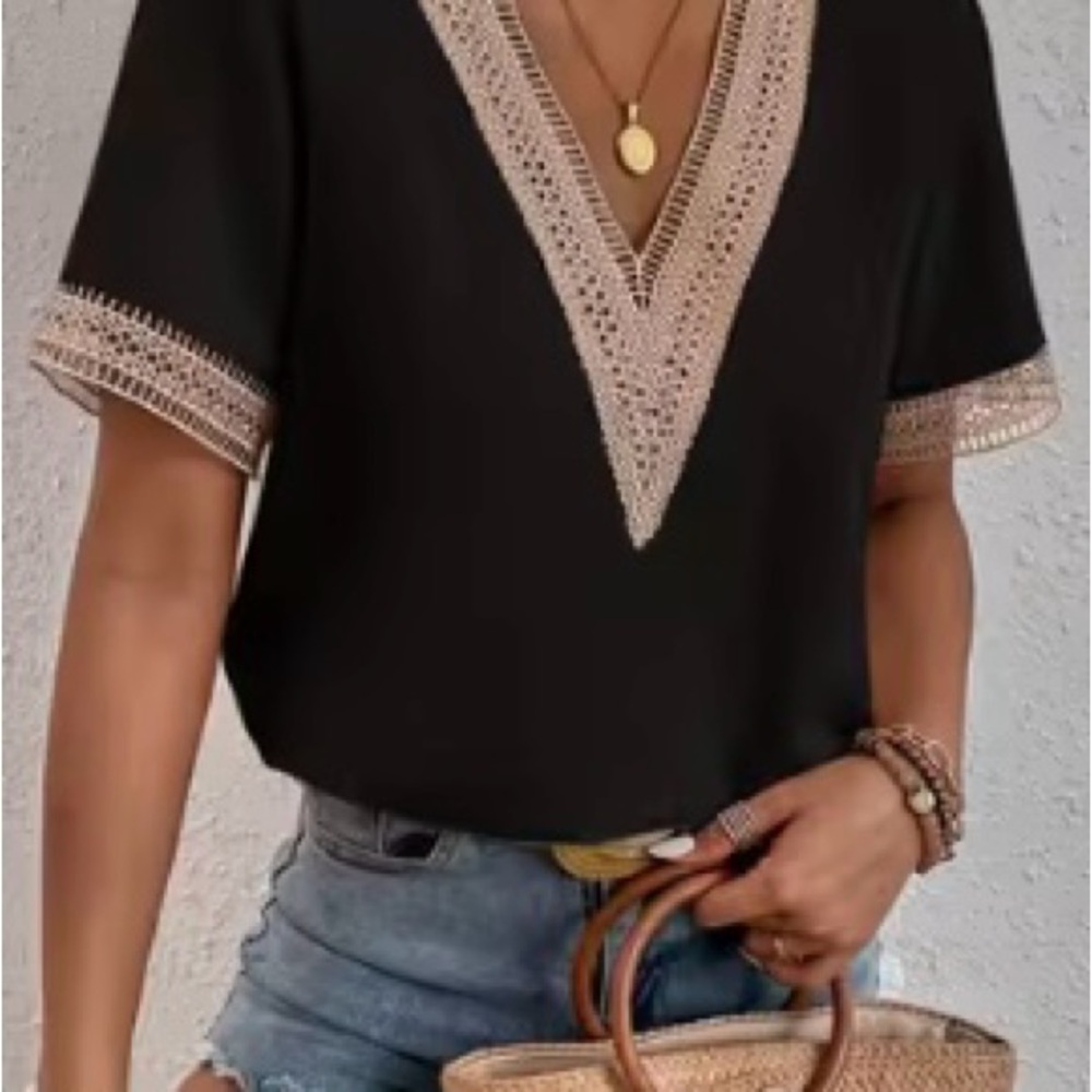 Lovely Black V neck blouse with crochet type trim in size Medium